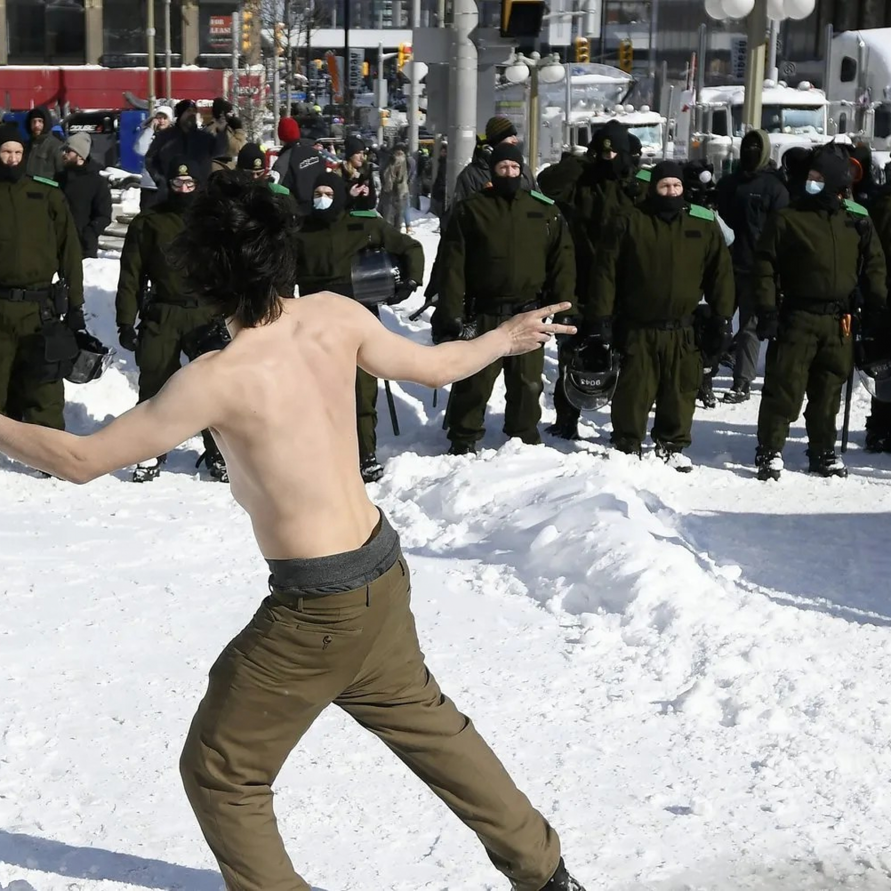 Huddling around fires dancing at Ottawa protest