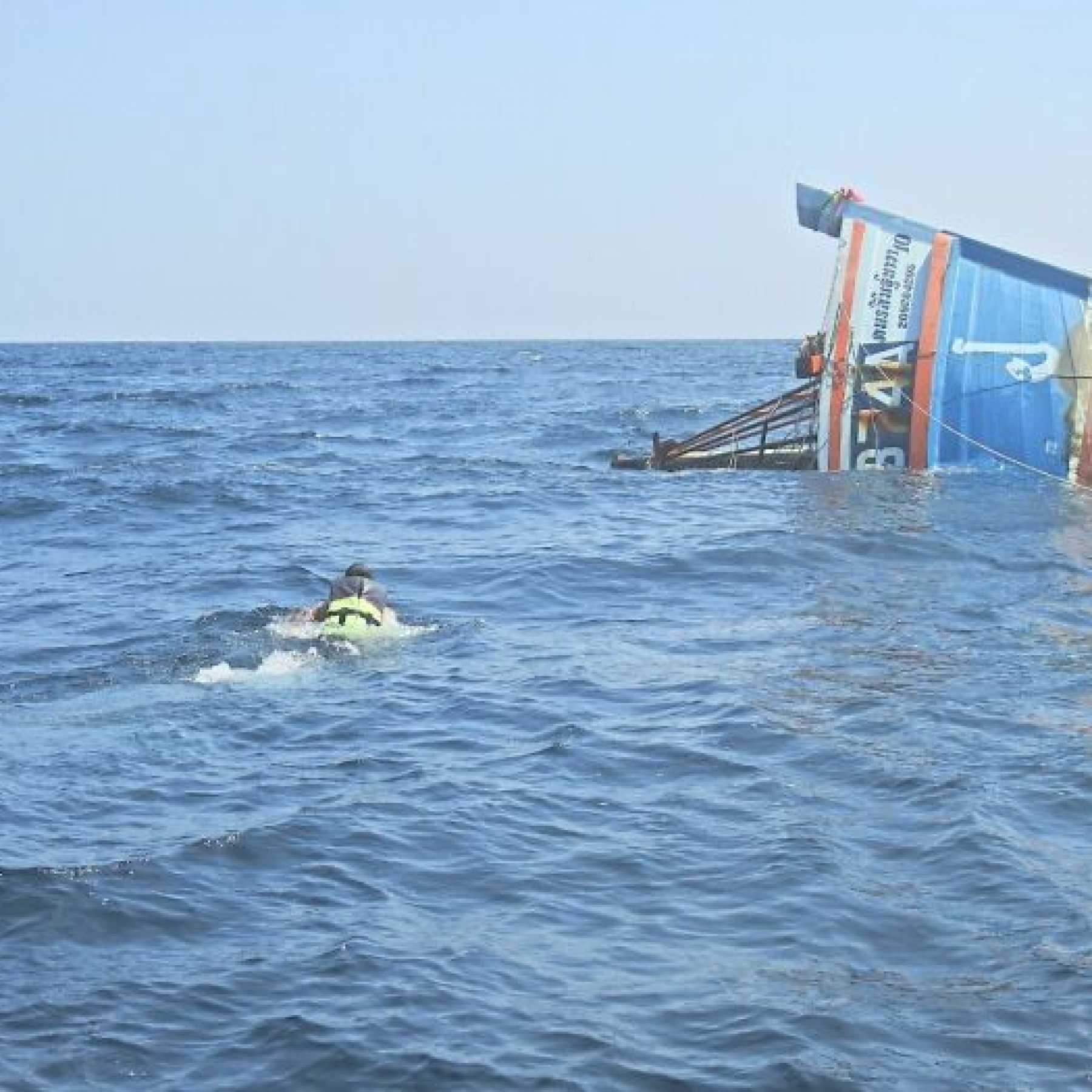 Sailors scrambled into lifeboats after the Sukhotai began sinking