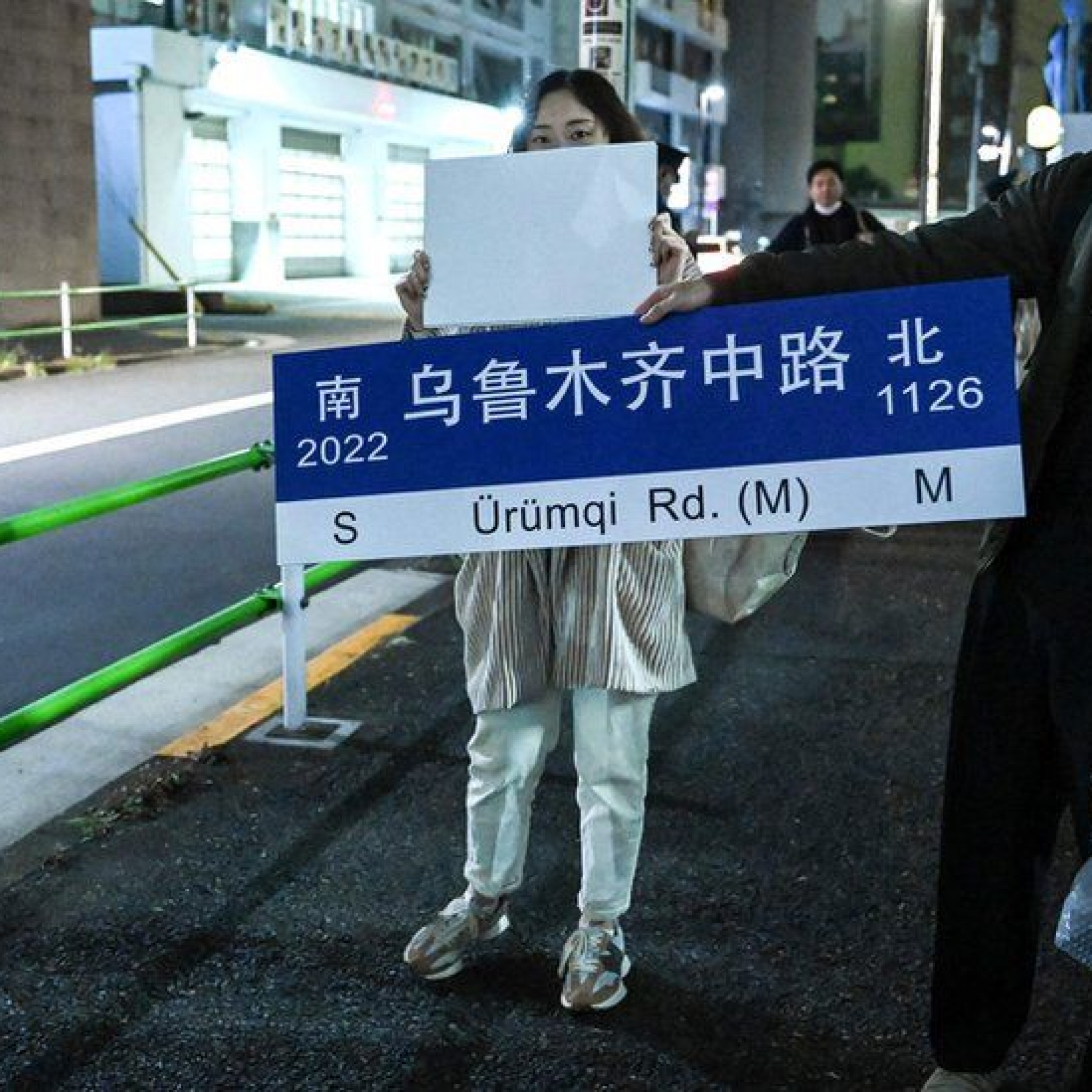 Symbols of the protests  like Urumqi Road  are being held outside overseas embassies in protest