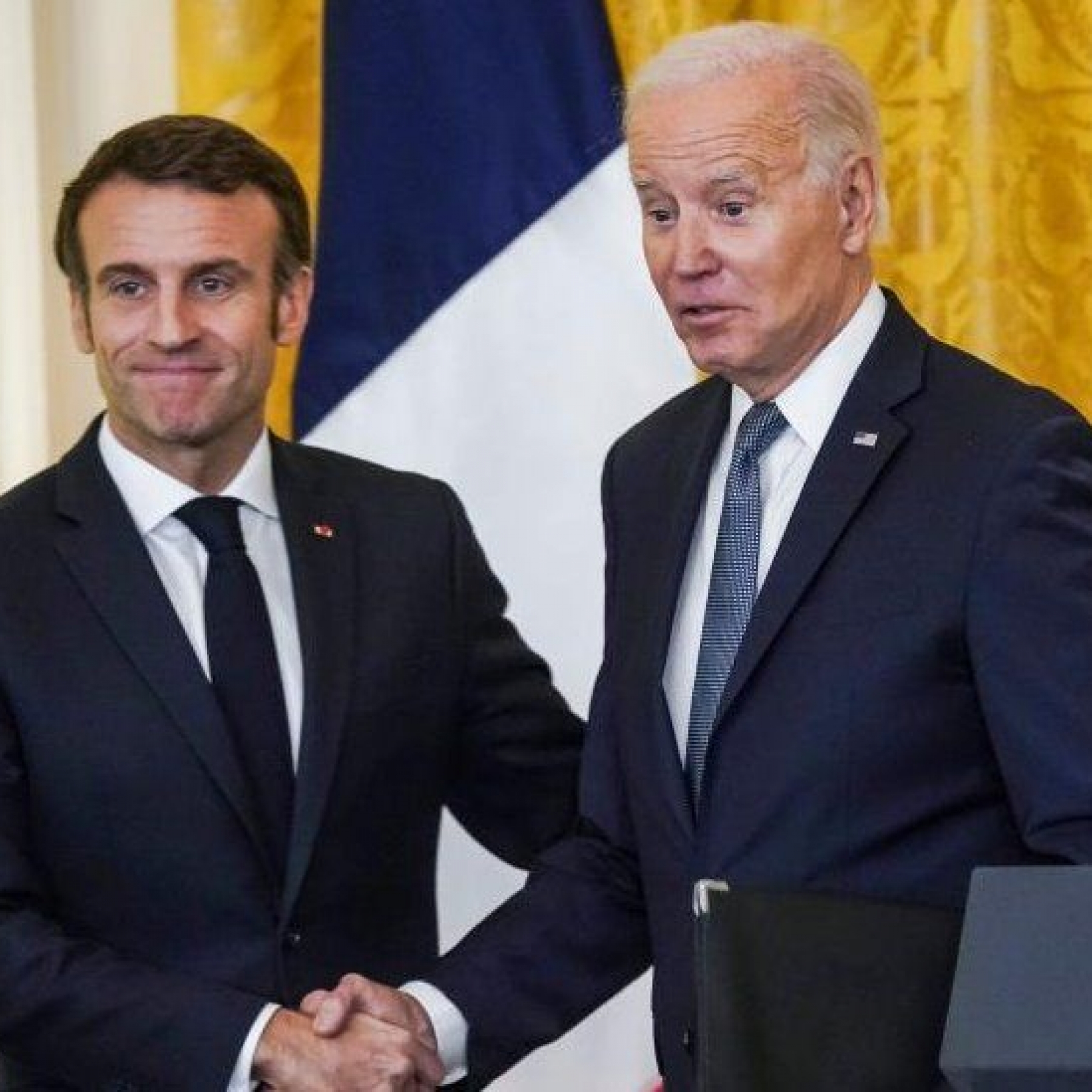 US President Joe Biden and French President Emmanuel Macron shake