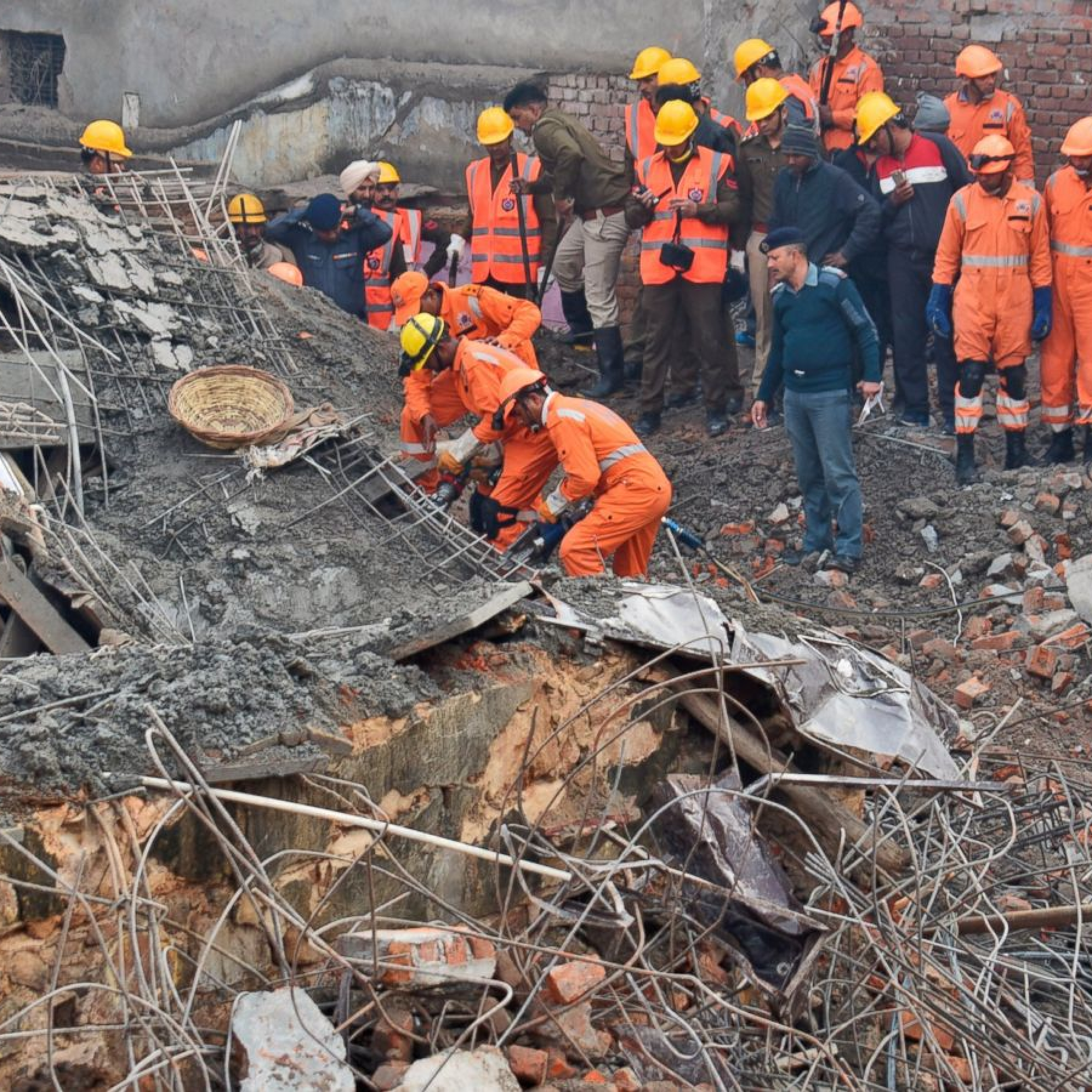 53 dead in China building collaps search for trapped ends as rescuers find 10 survivors