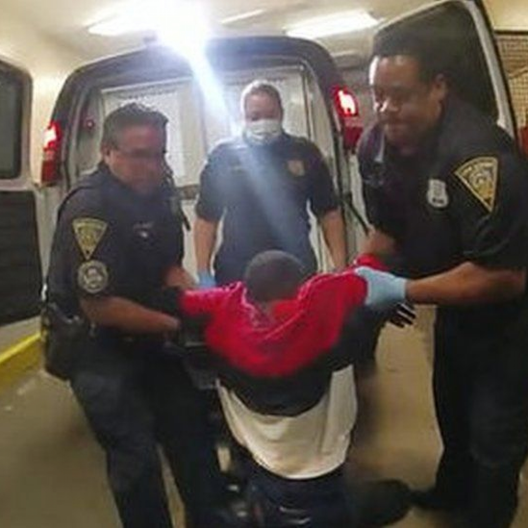  Officers charged after black man paralysed in van
