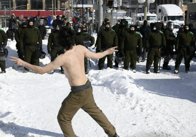 Huddling around fires dancing at Ottawa protest