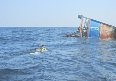 Sailors scrambled into lifeboats after the Sukhotai began sinking