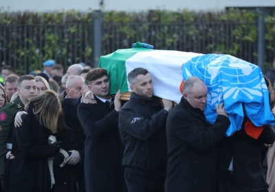 Both the Irish and UN flags were used to cover Pte Rooney's coffin