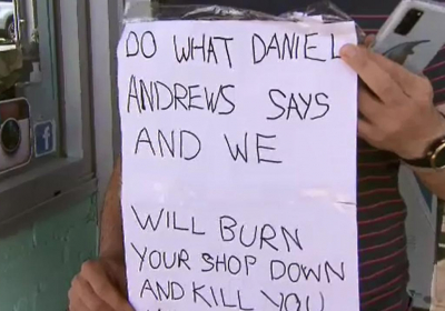 Melbourne cafe owner Simon Kandias finds threatening note brick through window