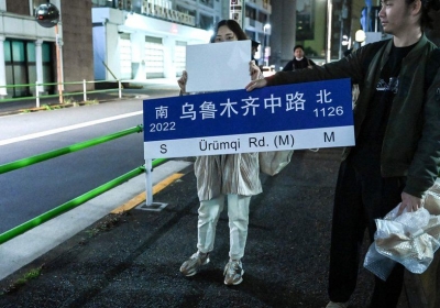 Symbols of the protests  like Urumqi Road  are being held outside overseas embassies in protest