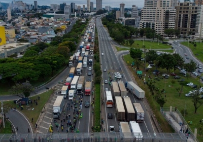A long line of trucks take part in a blockade on a highway on the outskirts of Sao Paulo on 2 November