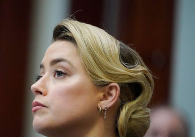 Amber Heard denies striking Johnny Depp and doctoring photos